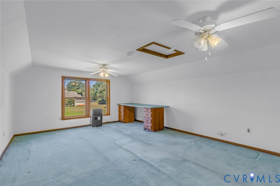 831 Fountain Gate Road Heathsville, VA 22473 - Photo 30 of 50 a view of a livingroom with a ceiling fan and window