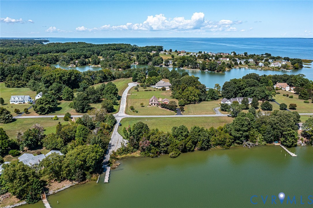 831 Fountain Gate Road Heathsville, VA 22473 - Photo 3 of 50 an aerial view of a houses with a lake