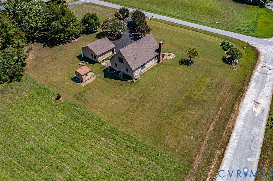 831 Fountain Gate Road Heathsville, VA 22473 - Photo 33 of 50 an aerial view of a house with a garden and swimming pool