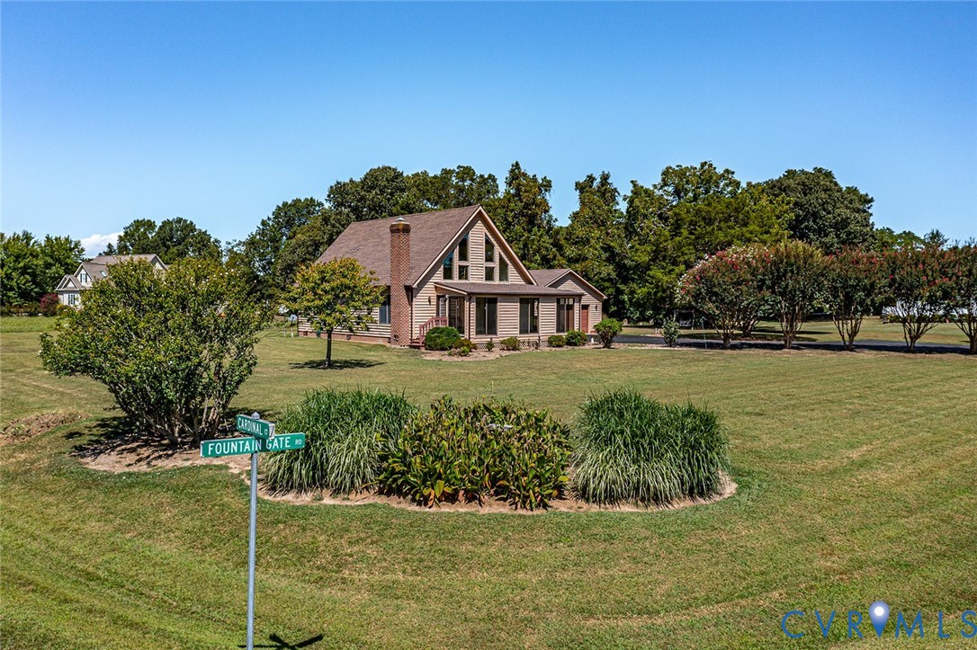831 Fountain Gate Road Heathsville, VA 22473 - Photo 36 of 50 a front view of a house with a yard