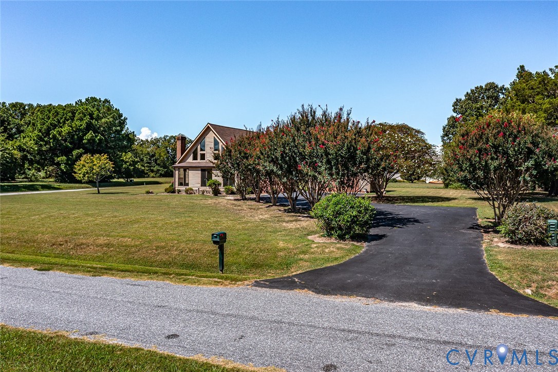 831 Fountain Gate Road Heathsville, VA 22473 - Photo 37 of 50 a view of a swimming pool with an outdoor seating and a garden