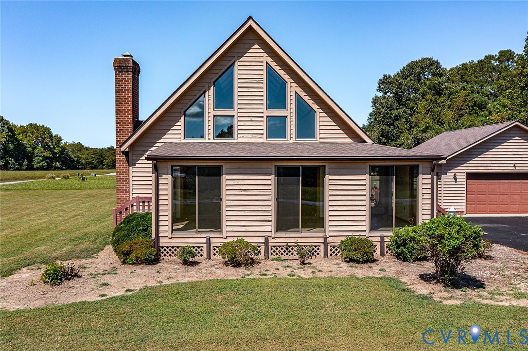 831 Fountain Gate Road Heathsville, VA 22473 - Photo 39 of 50 a front view of a house with garden