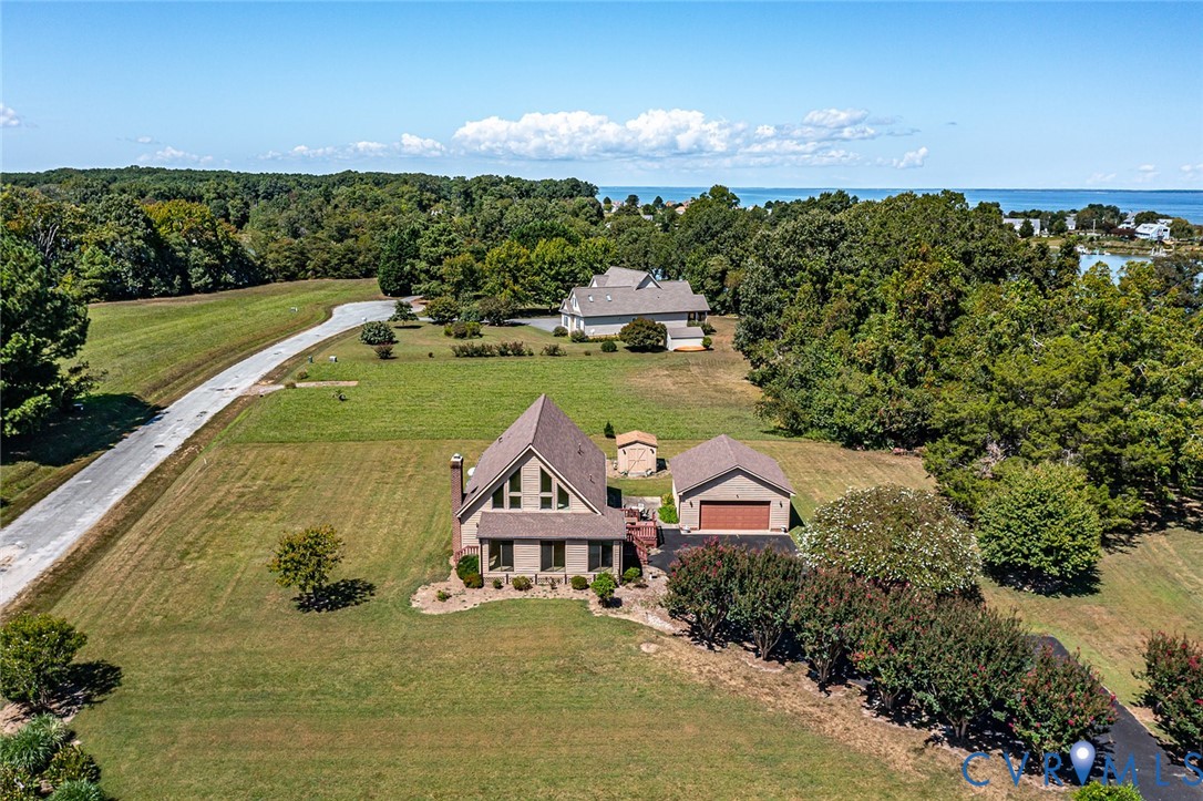 831 Fountain Gate Road Heathsville, VA 22473 - Photo 47 of 50 an aerial view of a house with a garden and lake view