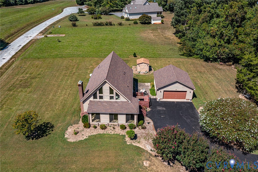 831 Fountain Gate Road Heathsville, VA 22473 - Photo 48 of 50 an aerial view of a house with a garden fire pit