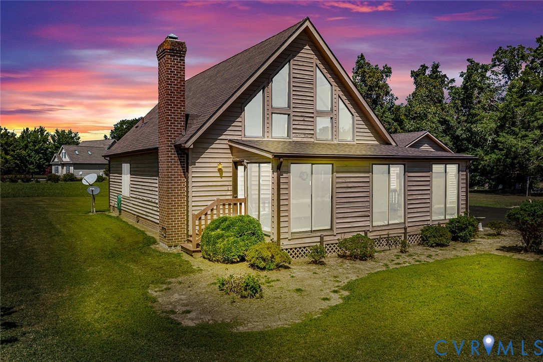 831 Fountain Gate Road Heathsville, VA 22473 - Photo 7 of 50 a front view of a house with garden