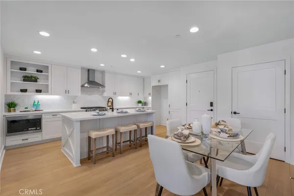 a kitchen with a table and chairs in it