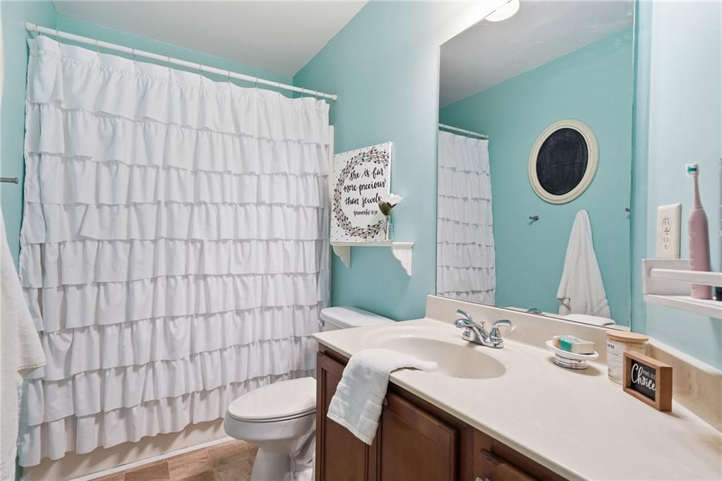 615 Myers Gate Road Ball Ground, GA 30107 - Photo 30 of 43 a bathroom with a sink toilet and mirror