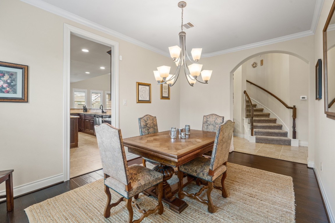 1607 Quail Ridge Drive Katy, TX 77493 - Photo 11 of 33 This bright and inviting dining room is centrally located within the home and features tall ceilings, abundant natural light, and an elegant chandelier, illuminating the room. Perfectly designed for hosting gatherings and conveniently located in close proximity to the kitchen for service.