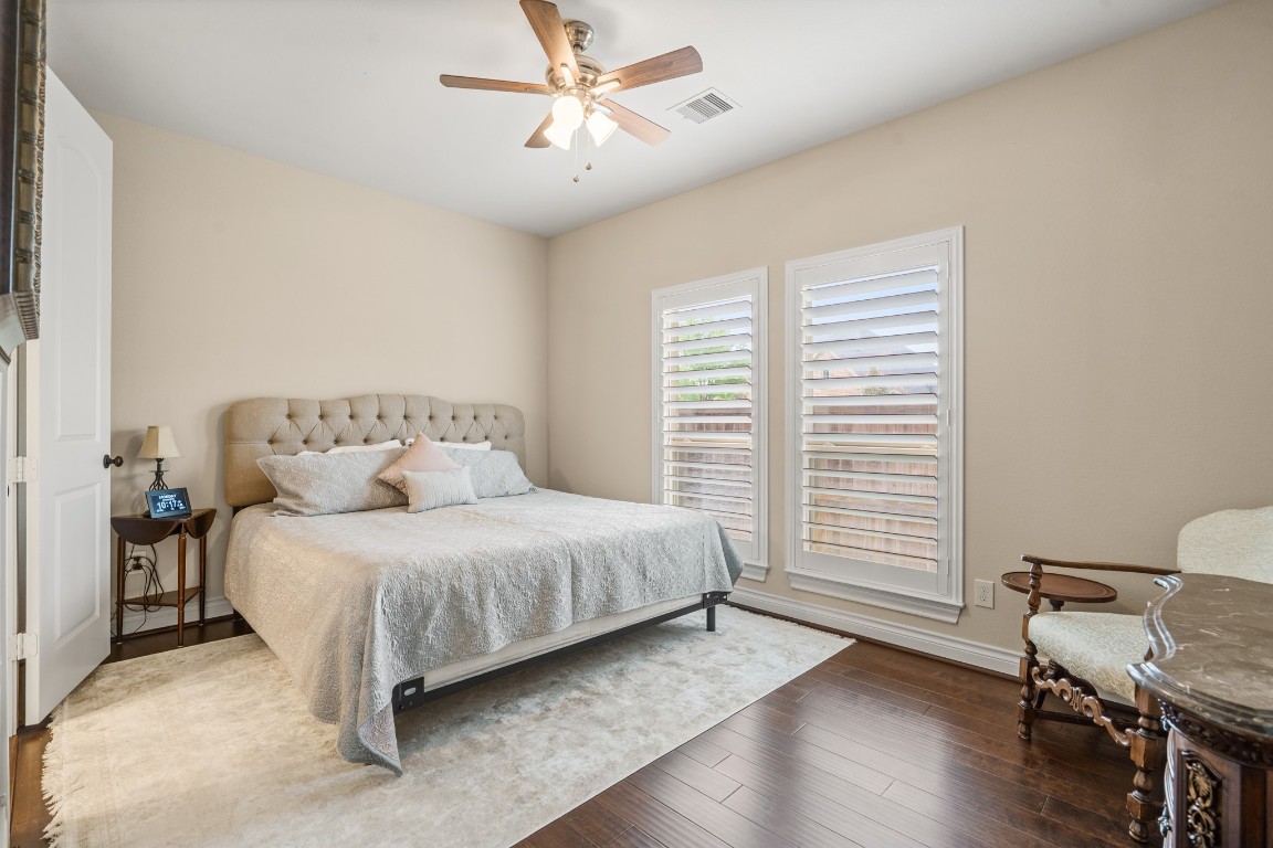 1607 Quail Ridge Drive Katy, TX 77493 - Photo 20 of 33 Nestled away quietly, the guest suite is tucked towards the front of the home on the first floor, with an ensuite bathroom, for optimal privacy.
