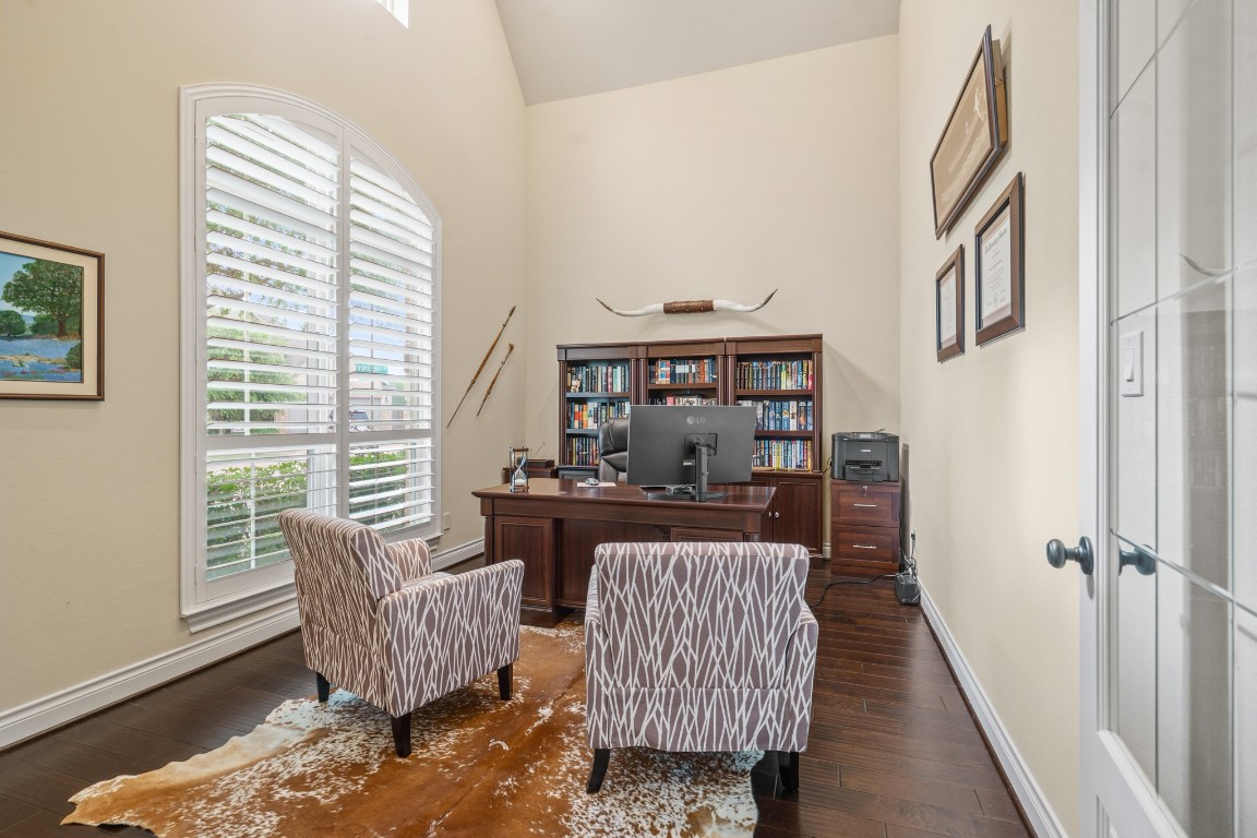 1607 Quail Ridge Drive Katy, TX 77493 - Photo 5 of 33 This stunning home office features engineered wood flooring, custom plantation shutters, and double French doors for added privacy. What a perfect place for a home office or hobby room.