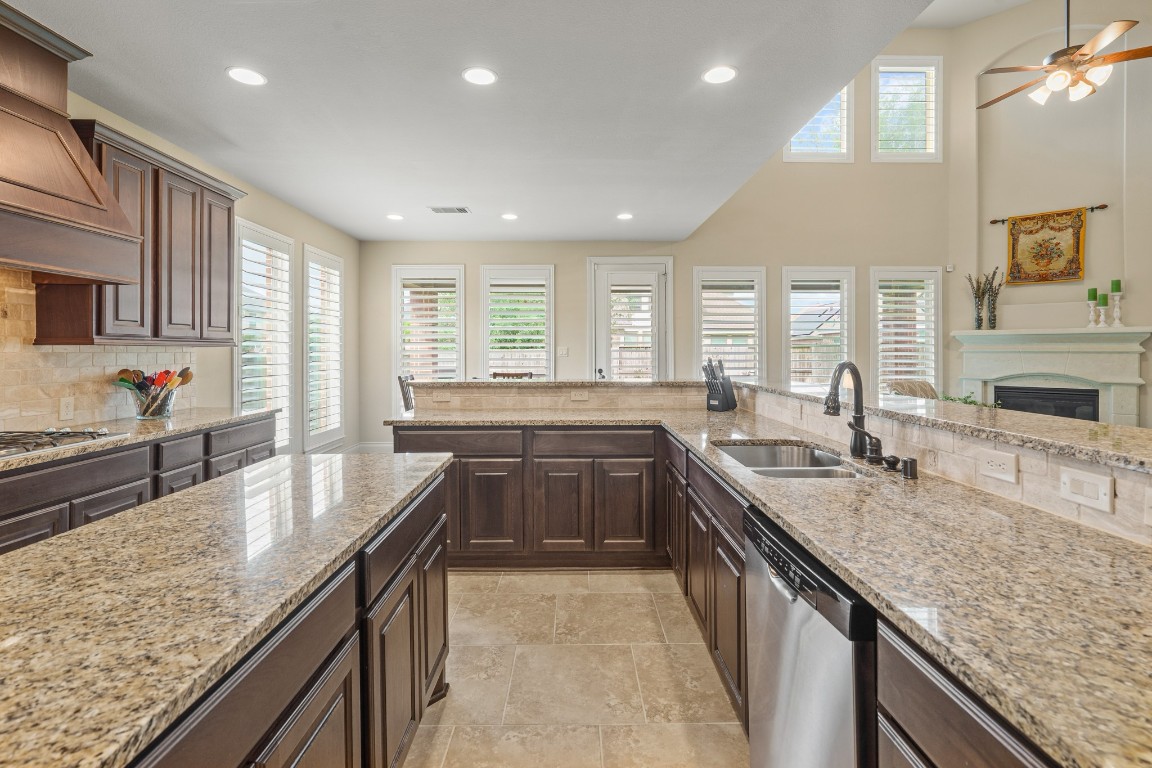 1607 Quail Ridge Drive Katy, TX 77493 - Photo 8 of 33 The kitchen is conveniently located with easy access to the oversized covered patio, making it perfect for outdoor dinners! Designed for both everyday living and entertaining, it offers a seamless flow and modern functionality throughout.