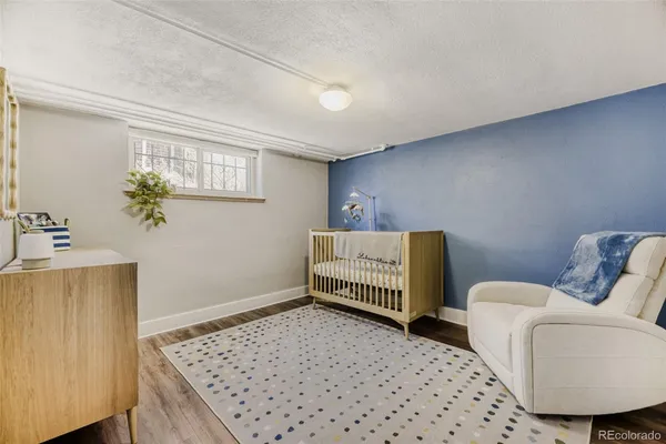 a bedroom with a bed and a couch