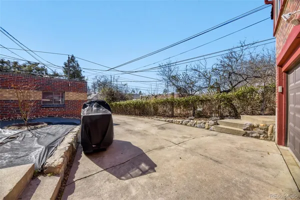 a view of a house with wooden fence