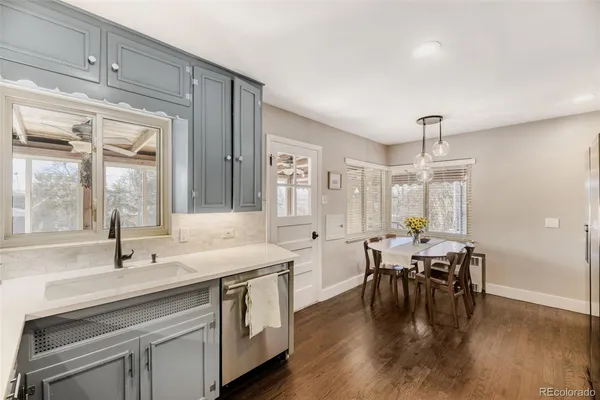a kitchen with lots of counter top space and dining table
