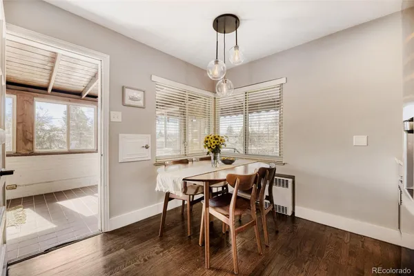 a view of a dining room with furniture window and wooden floor
