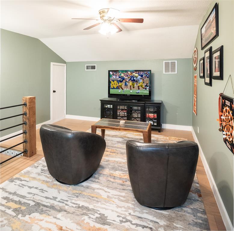 1451 Meandro Ria Lane Fairview, TX 75069 - Photo 24 of 38 a living room with furniture and a flat screen tv