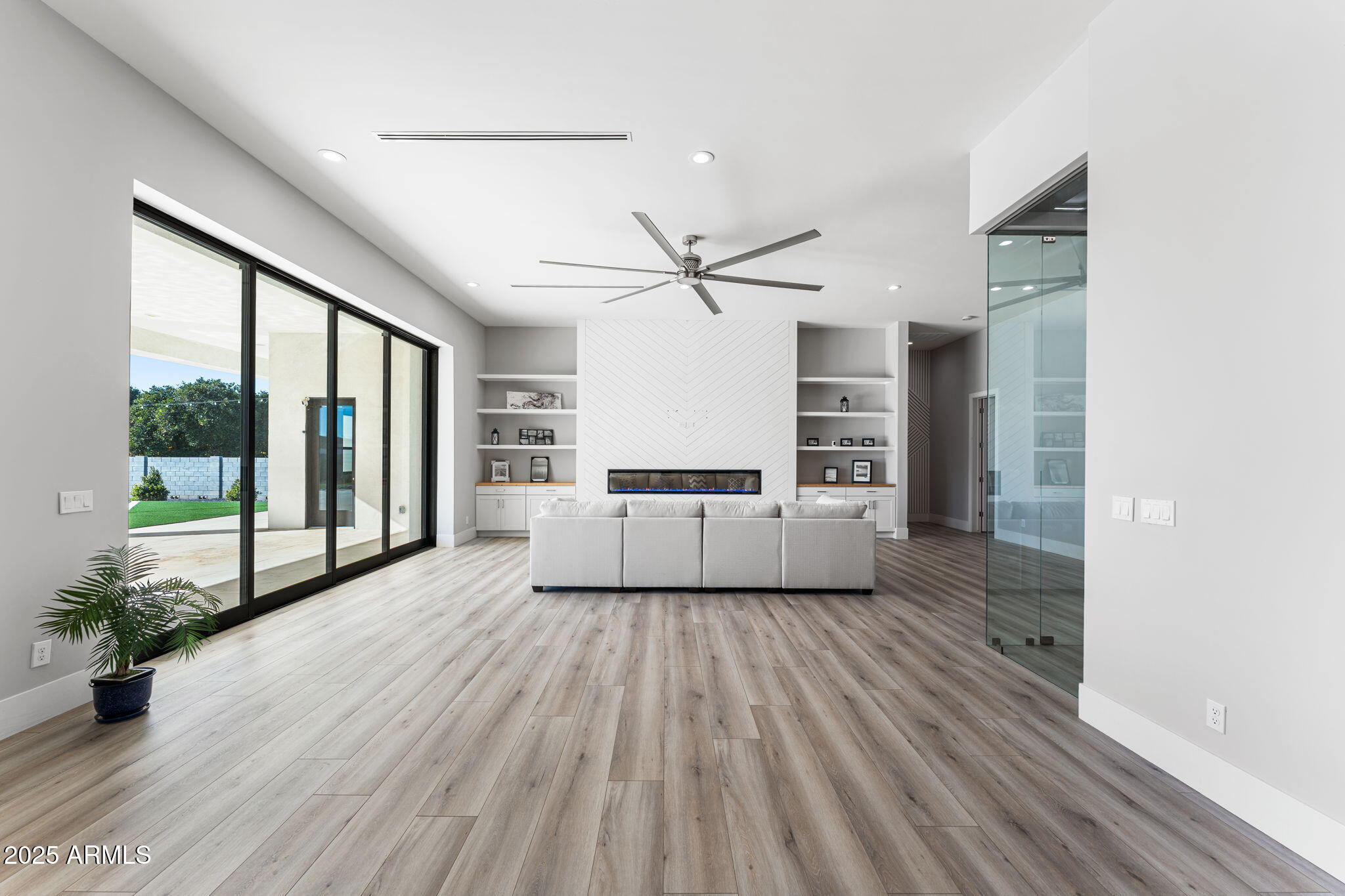 24614 South 183rd Street Gilbert, AZ 85298 - Photo 14 of 45 a view of a kitchen with a sink a ceiling fan and wooden floor