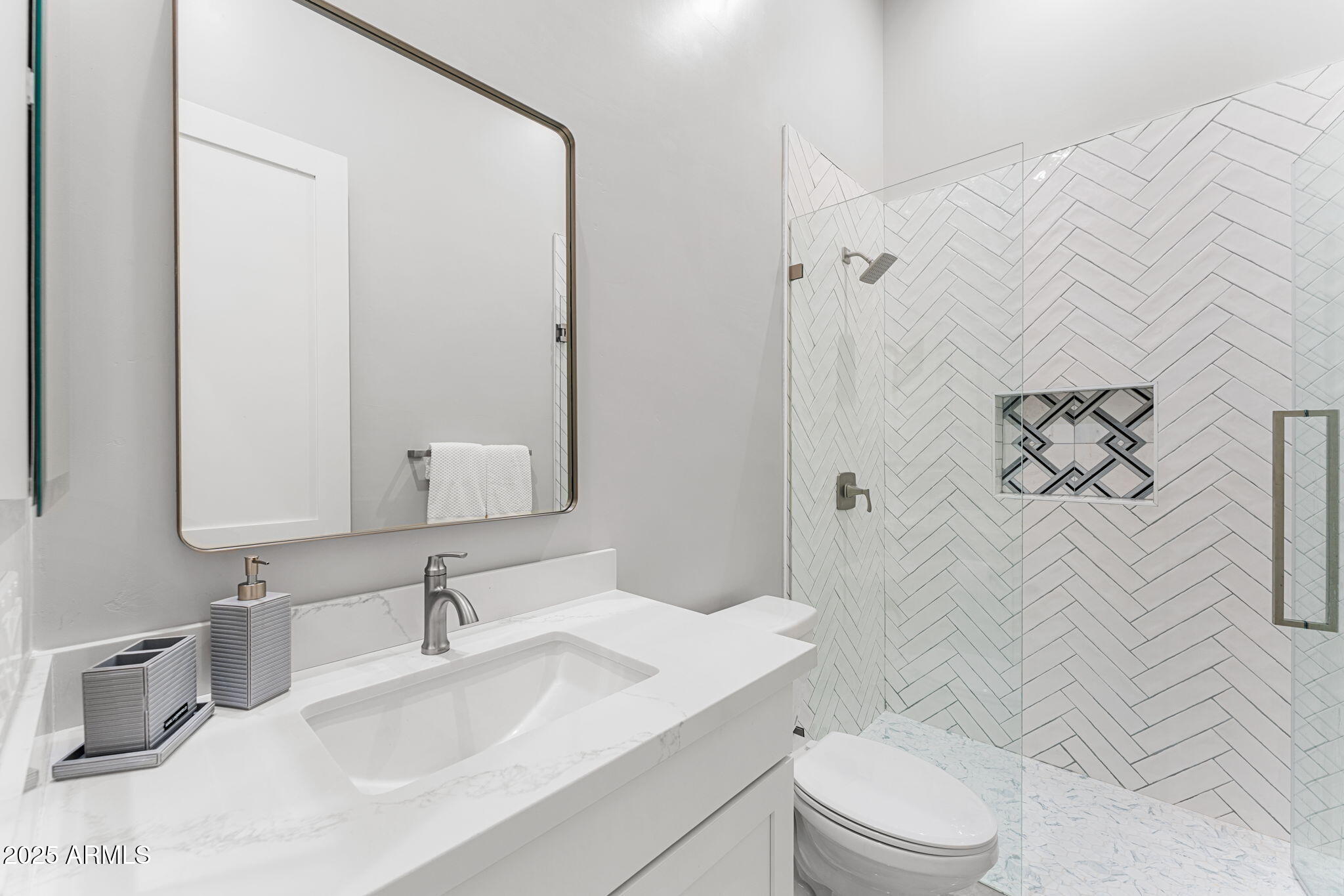 24614 South 183rd Street Gilbert, AZ 85298 - Photo 31 of 45 a bathroom with a sink a toilet and shower