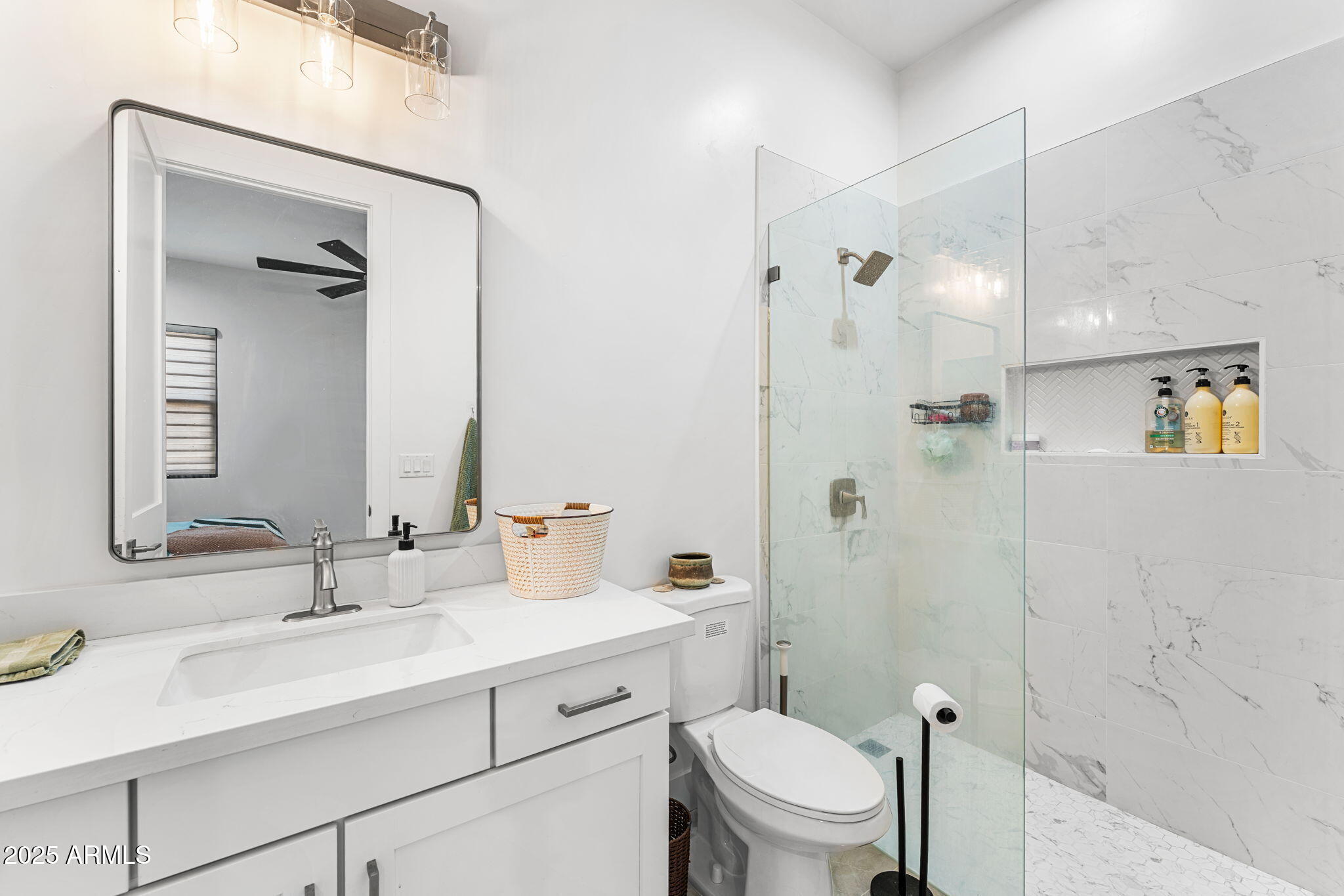 24614 South 183rd Street Gilbert, AZ 85298 - Photo 33 of 45 a bathroom with a sink toilet vanity and shower