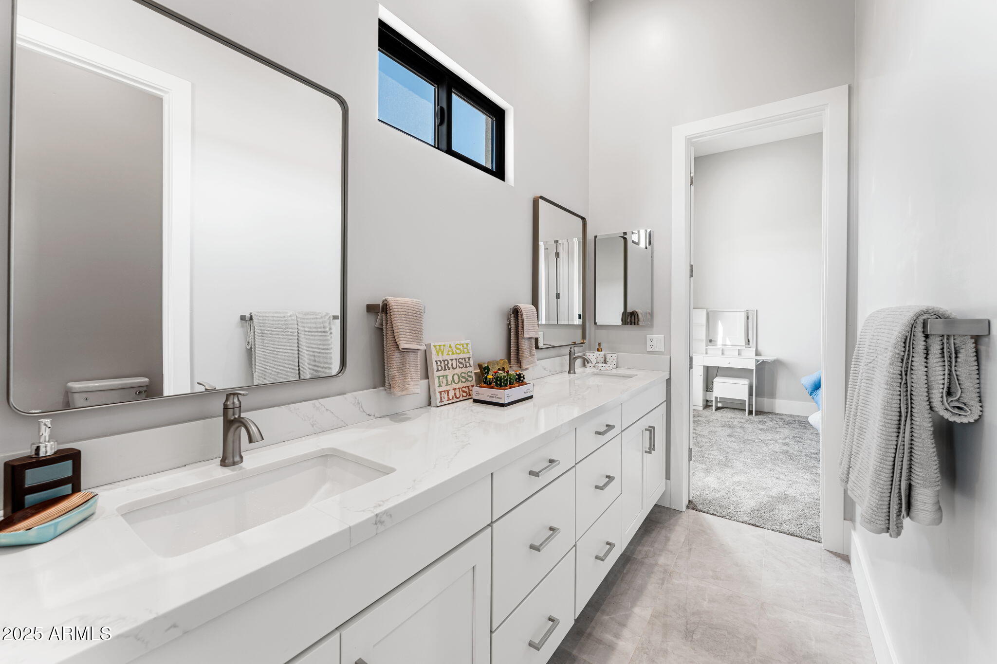 24614 South 183rd Street Gilbert, AZ 85298 - Photo 35 of 45 a en suite bathroom with double sink and a mirror