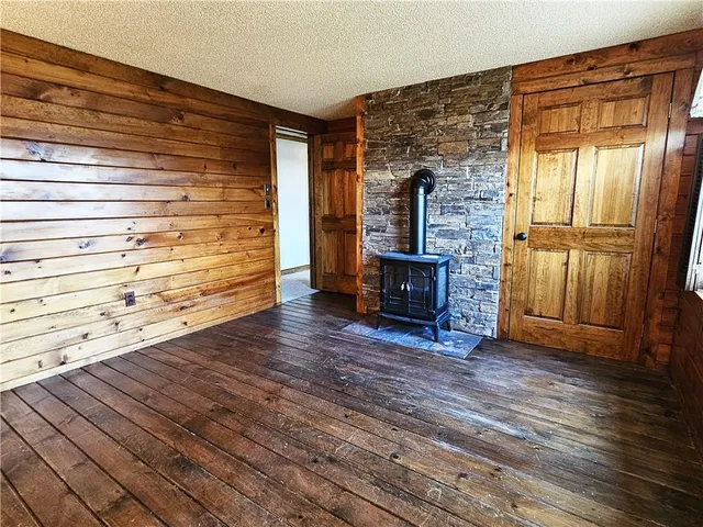 a view of a livingroom with a furniture window and wooden floor