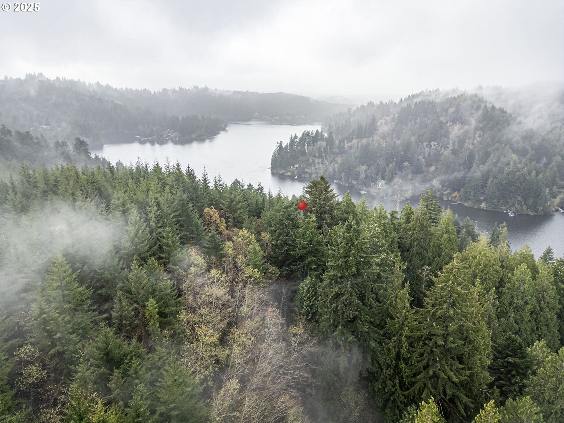 600 Erlandson Road Florence, OR 97439 - Photo 5 of 31 a view of a lake with a mountain in the background