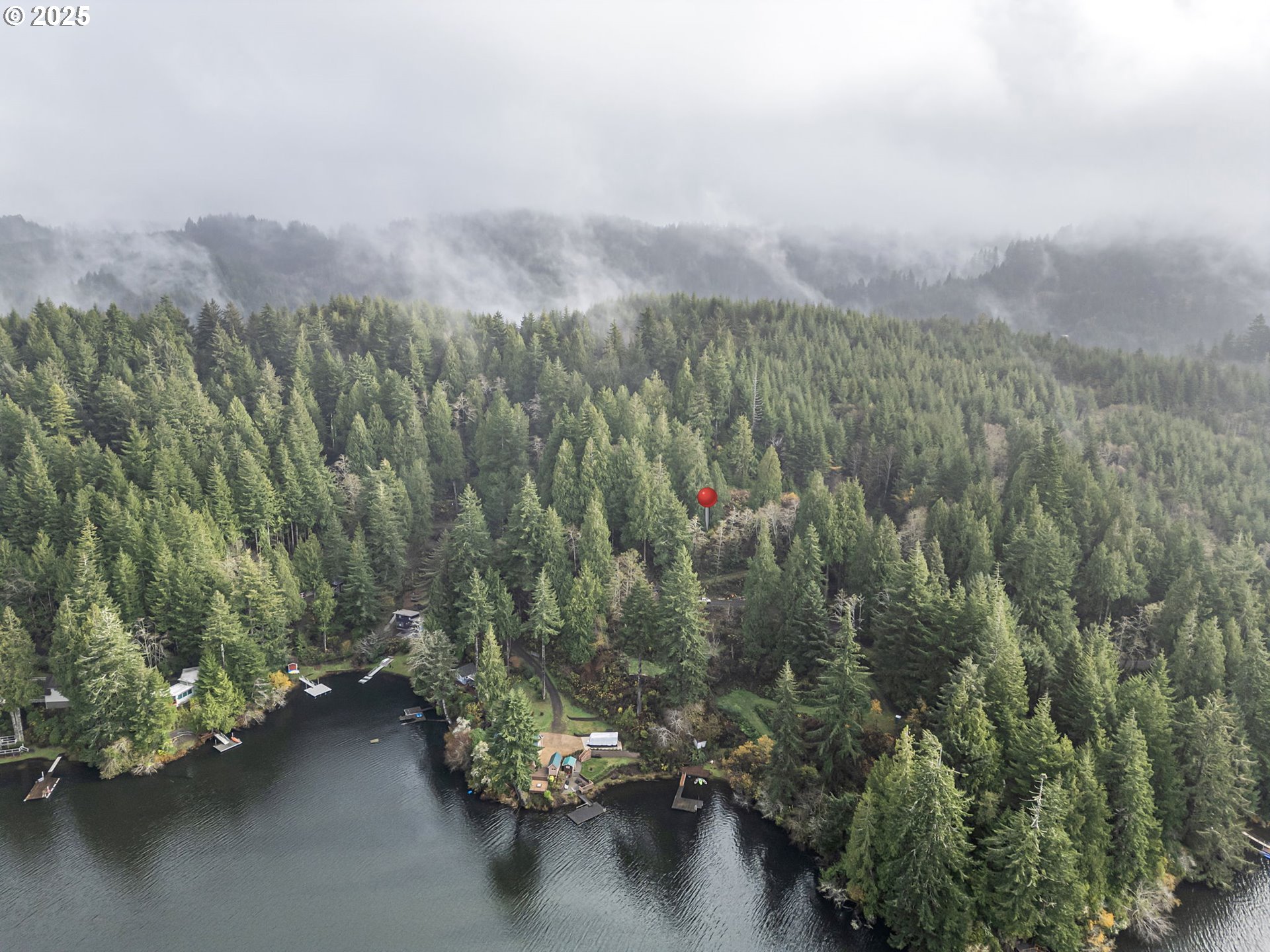 600 Erlandson Road Florence, OR 97439 - Photo 7 of 31 a view of a city with lush green forest