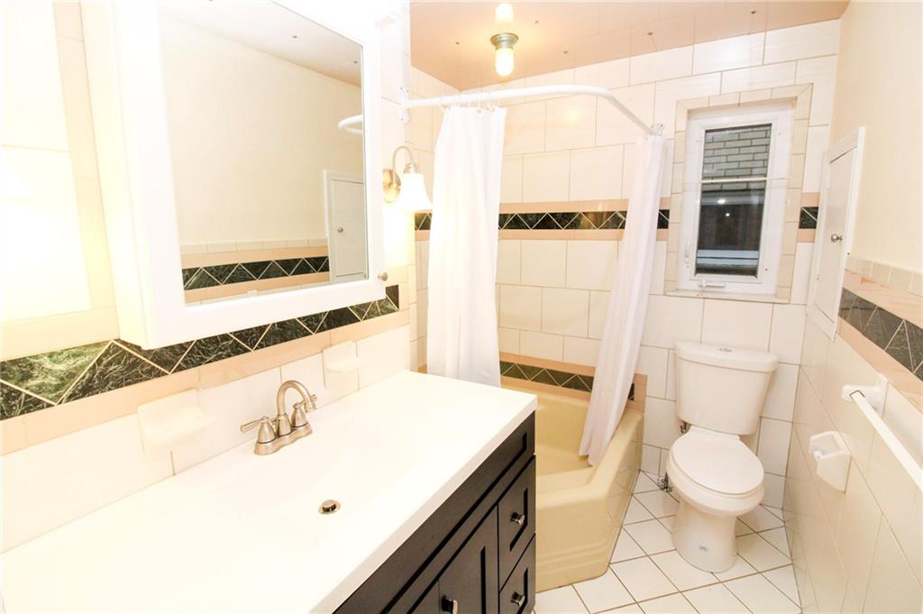 558 Hillcrest Avenue McKees Rocks, PA 15136 - Photo 15 of 25 Tiled full bath on the main floor
