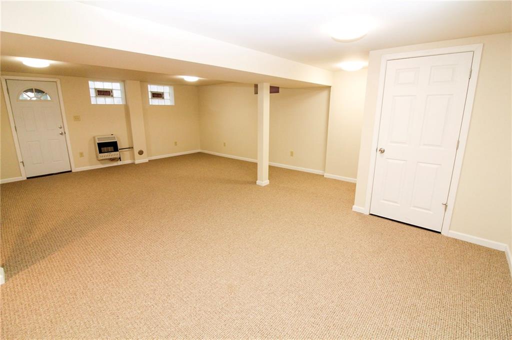 558 Hillcrest Avenue McKees Rocks, PA 15136 - Photo 18 of 25 Finished basement with door to the backyard