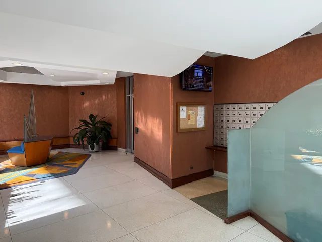 a view of swimming pool with a couches in patio