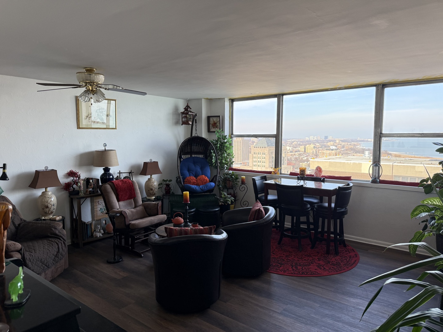 6301 North Sheridan Road, Unit 24C Chicago, IL 60660 - Photo 7 of 27 a living room with furniture a fireplace and large windows