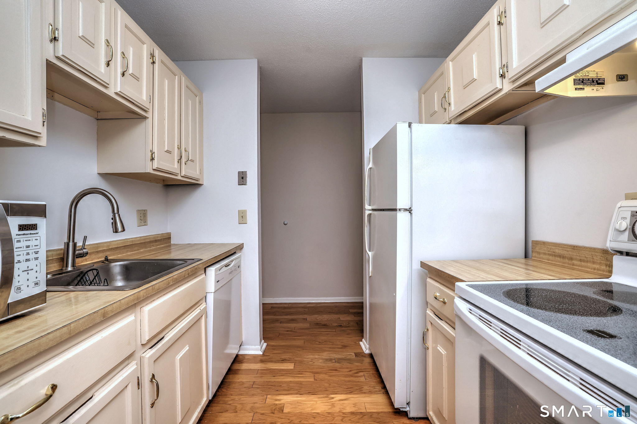 43 Balance Rock Road, Unit 11 Seymour, CT 06483 - Photo 13 of 40 a kitchen with stainless steel appliances granite countertop a sink and a refrigerator