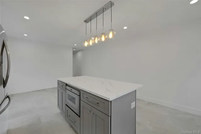 a view of a hallway with washer and dryer