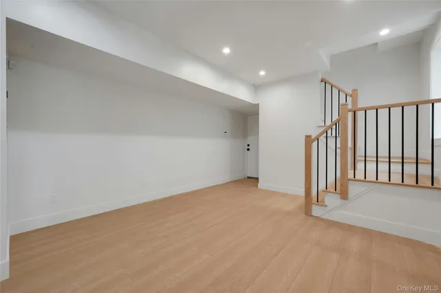 a view of a room with wooden floor