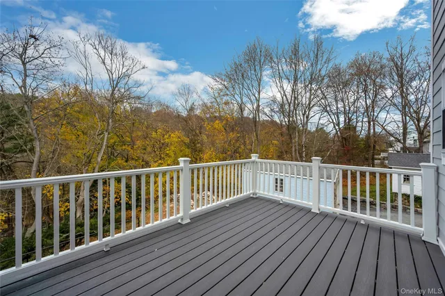a view of balcony with wooden floor
