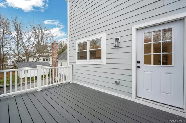 a view of a house with wooden deck