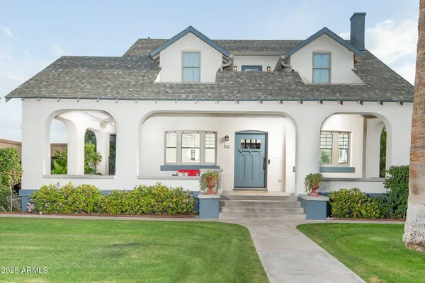 a front view of a house with garden