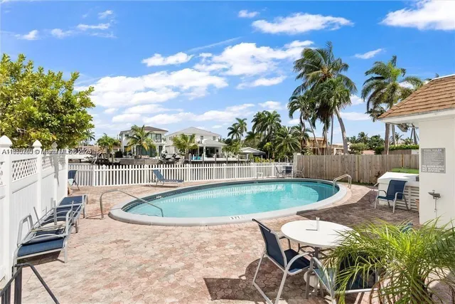 a view of a swimming pool with a patio