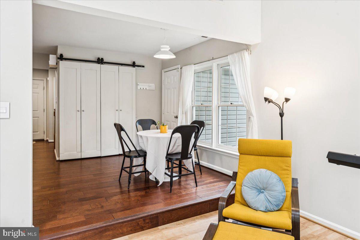 12592 Rock Ridge Road Herndon, VA 20170 - Photo 17 of 41 a dining room with furniture and wooden floor
