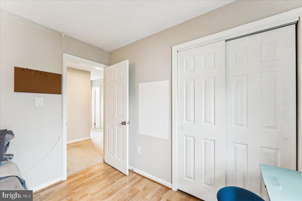 12592 Rock Ridge Road Herndon, VA 20170 - Photo 28 of 41 a view of a livingroom with wooden floor and closet