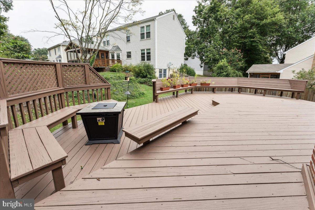 12592 Rock Ridge Road Herndon, VA 20170 - Photo 30 of 41 a view of balcony with wooden floor and outdoor seating
