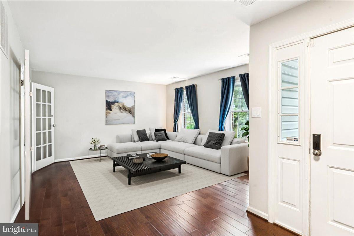 12592 Rock Ridge Road Herndon, VA 20170 - Photo 3 of 41 a living room with furniture and a large window