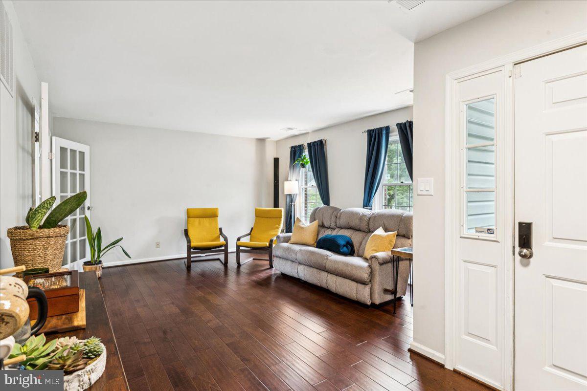 12592 Rock Ridge Road Herndon, VA 20170 - Photo 6 of 41 a living room with furniture and a wooden floor