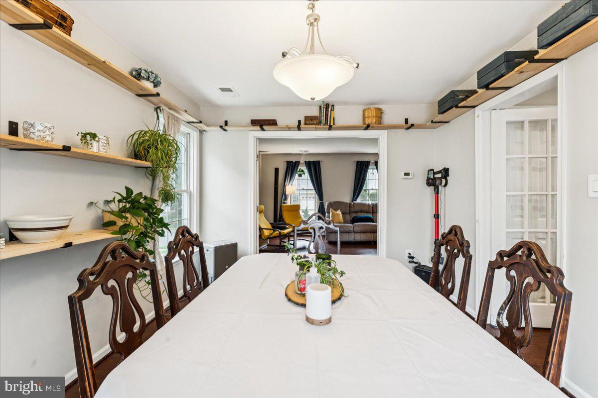 12592 Rock Ridge Road Herndon, VA 20170 - Photo 9 of 41 a view of a livingroom with furniture and a chandelier