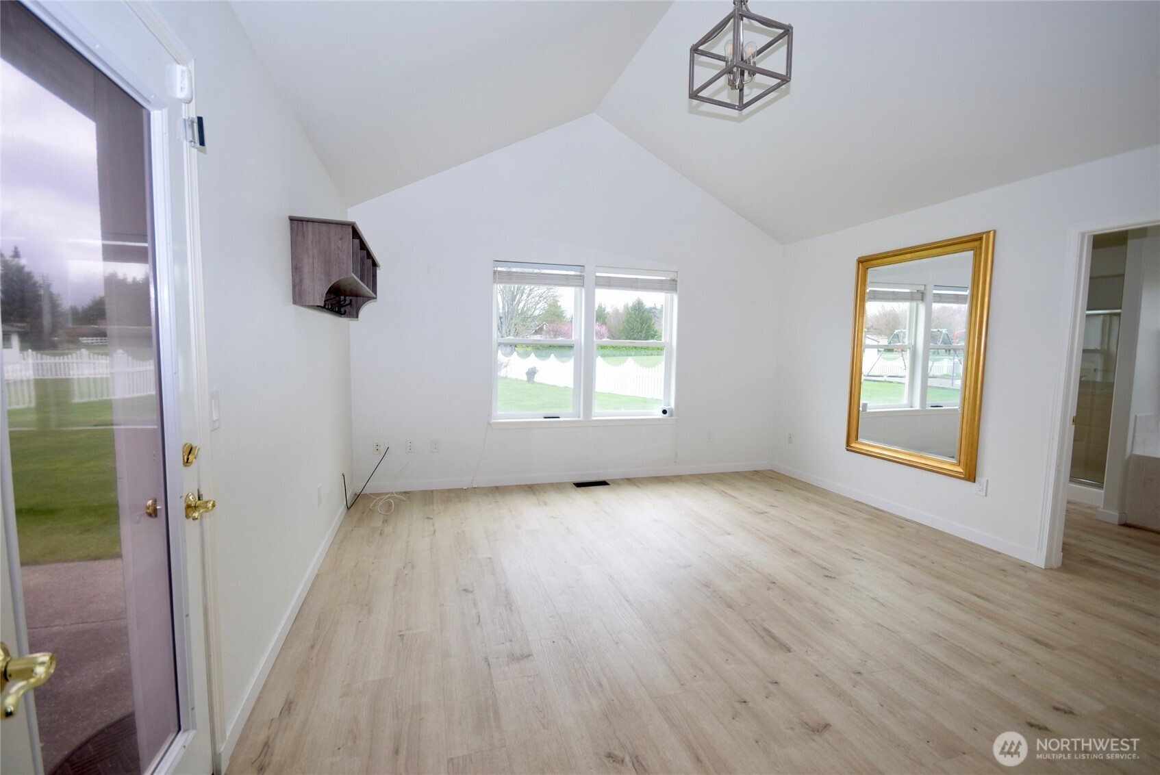 71 John Carl Road Sequim, WA 98382 - Photo 16 of 37 an empty room with wooden floor and windows