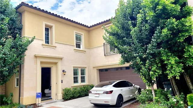 a front view of house with yard and trees