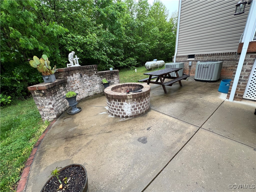 132 Forest View Road Cumberland, VA 23040 - Photo 11 of 31 View of patio with central AC unit and an outdoor