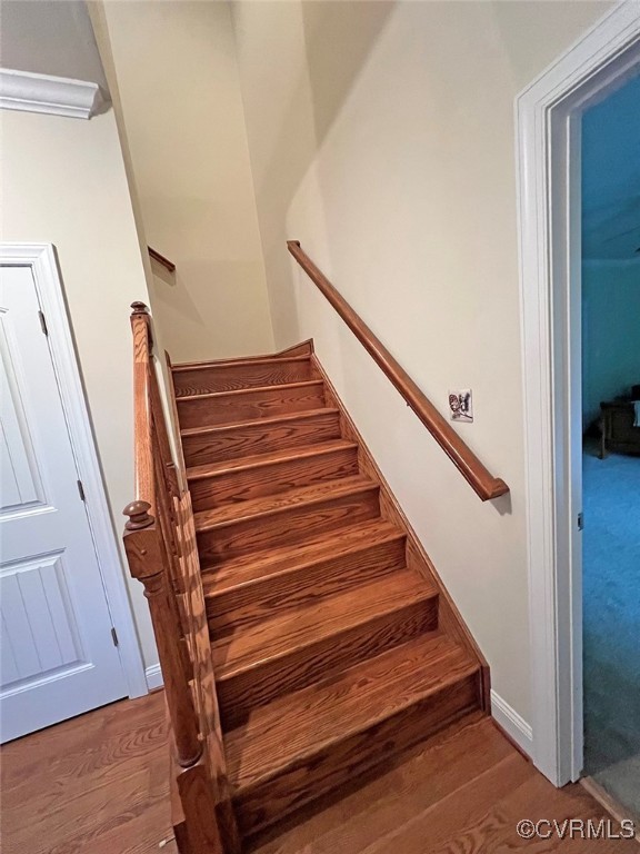 132 Forest View Road Cumberland, VA 23040 - Photo 21 of 31 Stairway featuring crown molding and wood-type flo