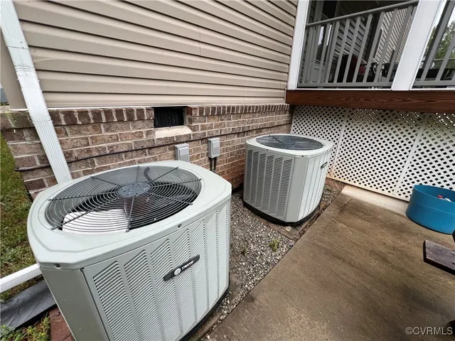 a view of a patio with table and chairs and potted plants