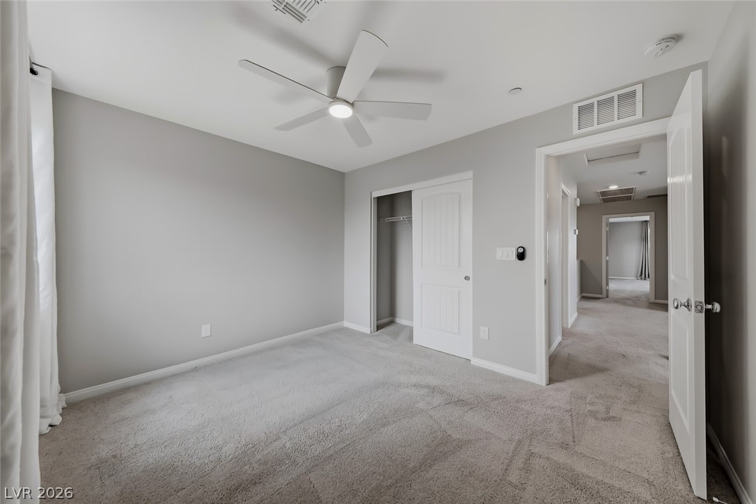 3564 Credere Lane Henderson, NV 89074 - Photo 28 of 40 Unfurnished bedroom featuring light colored carpet, a closet, and a ceiling fan